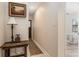 Hallway with dark wood doors, light-colored walls, and vintage-style accents at 7563 Nw 21St St, Ocala, FL 34482
