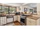 Kitchen featuring a farmhouse sink, stainless steel oven and stainless appliances at 7563 Nw 21St St, Ocala, FL 34482