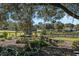 View of manicured grounds featuring a gazebo, a bird bath, and lush greenery at 7563 Nw 21St St, Ocala, FL 34482