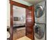 Hall laundry closet with stacked washer and dryer viewed from main bedroom at 7563 Nw 21St St, Ocala, FL 34482