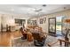 Open-concept living room featuring hardwood floors, and plenty of natural light at 7563 Nw 21St St, Ocala, FL 34482