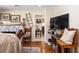 Bright living room featuring a stone fireplace, hardwood floors and a view to another room at 7563 Nw 21St St, Ocala, FL 34482