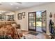 Living room featuring hardwood floors and open french doors to the outside at 7563 Nw 21St St, Ocala, FL 34482
