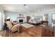 Expansive main bedroom with a stone fireplace, hardwood floors, and ample natural light at 7563 Nw 21St St, Ocala, FL 34482