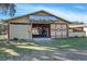 Open outbuilding with a large doorway, revealing interior storage and organization capabilities at 7563 Nw 21St St, Ocala, FL 34482