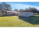 Outbuildings on lush acreage, offering functional spaces for storage and livestock at 7563 Nw 21St St, Ocala, FL 34482