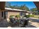 Outdoor patio with brick pavers, seating, and string lights, perfect for outdoor entertaining and relaxation at 7563 Nw 21St St, Ocala, FL 34482