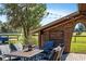 Outdoor patio with seating, brick pavers and view of horse in the pasture at 7563 Nw 21St St, Ocala, FL 34482