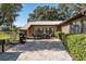 Outdoor patio boasts ample seating, a grill, and well-maintained landscaping, perfect for entertaining at 7563 Nw 21St St, Ocala, FL 34482