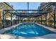 Enjoy the private in-ground pool within a screened enclosure, perfect for relaxation and entertainment at 7563 Nw 21St St, Ocala, FL 34482