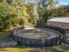 Exterior of a well-maintained round pen with a sturdy fence and ample space for training horses at 7563 Nw 21St St, Ocala, FL 34482