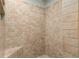 Close up of the beige tiled walk-in shower at 7563 Nw 21St St, Ocala, FL 34482