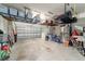 Spacious garage equipped with overhead storage racks, and room for projects and parking at 7814 Sw 97Th Cir, Ocala, FL 34481