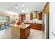 Large kitchen with stainless appliances, granite countertops, a kitchen island, and an eat-in nook at 7814 Sw 97Th Cir, Ocala, FL 34481