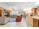 Open-concept living room with lots of natural light and adjacent gourmet kitchen at 7814 Sw 97Th Cir, Ocala, FL 34481