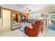 Comfortable living room showcasing tile flooring and stylish ceiling fan at 7814 Sw 97Th Cir, Ocala, FL 34481