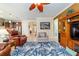 Spacious living room with tile floors offering views into the kitchen and entry at 7814 Sw 97Th Cir, Ocala, FL 34481