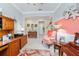Charming office area featuring a decorative accent wall, wood furnishings, and natural lighting at 7814 Sw 97Th Cir, Ocala, FL 34481