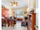 Office features a ceiling fan, built in Murphy bed, plantation shutters, and nautical decor at 7814 Sw 97Th Cir, Ocala, FL 34481