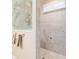 Spacious tiled shower with etched glass panel, grab bar, and convenient shelving niche at 7814 Sw 97Th Cir, Ocala, FL 34481