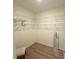 Walk-in closet features hardwood flooring and multiple wire racks for plenty of storage at 8303 Sw 78Th Cir, Ocala, FL 34476