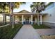 Community clubhouse entrance with well-maintained landscaping and a welcoming facade at 8303 Sw 78Th Cir, Ocala, FL 34476