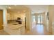 Open concept kitchen with stainless steel appliances and counter seating at 8303 Sw 78Th Cir, Ocala, FL 34476