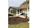 Backyard patio area with seating, white fence, and manicured landscaping at 8450 Sw 90Th St # D, Ocala, FL 34481