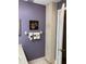 Bathroom featuring a tall linen cabinet and decorative wall art at 8450 Sw 90Th St # D, Ocala, FL 34481