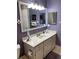 Bright bathroom features a neutral vanity and patterned floor at 8450 Sw 90Th St # D, Ocala, FL 34481