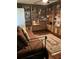 The bedroom features custom built-in wooden bookcases and hardwood floors, creating a cozy library feel at 8450 Sw 90Th St # D, Ocala, FL 34481