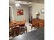 A dining room featuring a wood table and chairs set on tile flooring at 8450 Sw 90Th St # D, Ocala, FL 34481