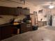 Organized garage space with shelving, workspace, and utility equipment at 8450 Sw 90Th St # D, Ocala, FL 34481