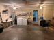 Functional garage space with laundry area, utility sink, and storage at 8450 Sw 90Th St # D, Ocala, FL 34481