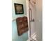Clean bathroom featuring a tiled shower with a clear glass door and grab bar at 8450 Sw 90Th St # D, Ocala, FL 34481