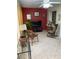 Bright sunroom with tile flooring, multiple windows, comfortable seating, and stylish decor at 8450 Sw 90Th St # D, Ocala, FL 34481