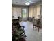 Bright sunroom with tile flooring, multiple windows, comfortable seating, and stylish decor at 8450 Sw 90Th St # D, Ocala, FL 34481