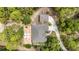 Aerial view of the property showcasing the home's layout, large lot and outdoor firepit area at 8605 Sw 209Th Court Rd, Dunnellon, FL 34431