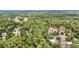 An aerial view of homes amidst a landscape of trees and nature at 8605 Sw 209Th Court Rd, Dunnellon, FL 34431