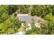 Aerial view of the property showing the house and landscaping in a wooded setting at 8605 Sw 209Th Court Rd, Dunnellon, FL 34431