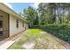 Well-maintained backyard with privacy fence, featuring a grassy lawn and low-maintenance landscaping at 8605 Sw 209Th Court Rd, Dunnellon, FL 34431
