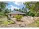 Expansive backyard with a fire pit and a screened patio extending the living space at 8605 Sw 209Th Court Rd, Dunnellon, FL 34431