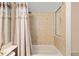 Bathroom with shower and bathtub area that has custom tile design and rainfall showerhead at 8605 Sw 209Th Court Rd, Dunnellon, FL 34431