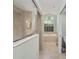 Bathroom with a large, tiled shower, arched window, and neutral colors at 8605 Sw 209Th Court Rd, Dunnellon, FL 34431