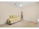 Bright, carpeted bedroom features a ceiling fan and a doorway that leads to other rooms at 8605 Sw 209Th Court Rd, Dunnellon, FL 34431