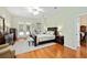 Spacious main bedroom with hardwood floors, ceiling fan, and dresser at 8605 Sw 209Th Court Rd, Dunnellon, FL 34431