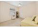 Bright bedroom features a neutral color palette, window with blinds, and carpeted floor at 8605 Sw 209Th Court Rd, Dunnellon, FL 34431