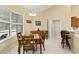 Cozy breakfast nook with natural light and views of the backyard at 8605 Sw 209Th Court Rd, Dunnellon, FL 34431