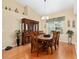 Traditional dining room with hardwood floors, ornate furniture and a large window at 8605 Sw 209Th Court Rd, Dunnellon, FL 34431