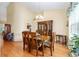 Dining room featuring hardwood floors, traditional dining table and a china cabinet at 8605 Sw 209Th Court Rd, Dunnellon, FL 34431